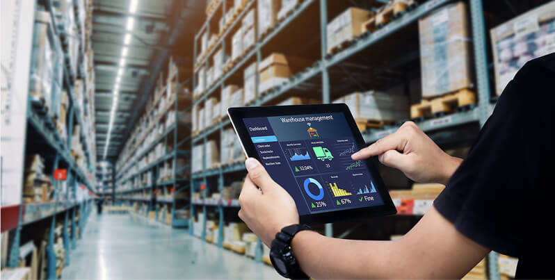 Man with tablet in warehouse
