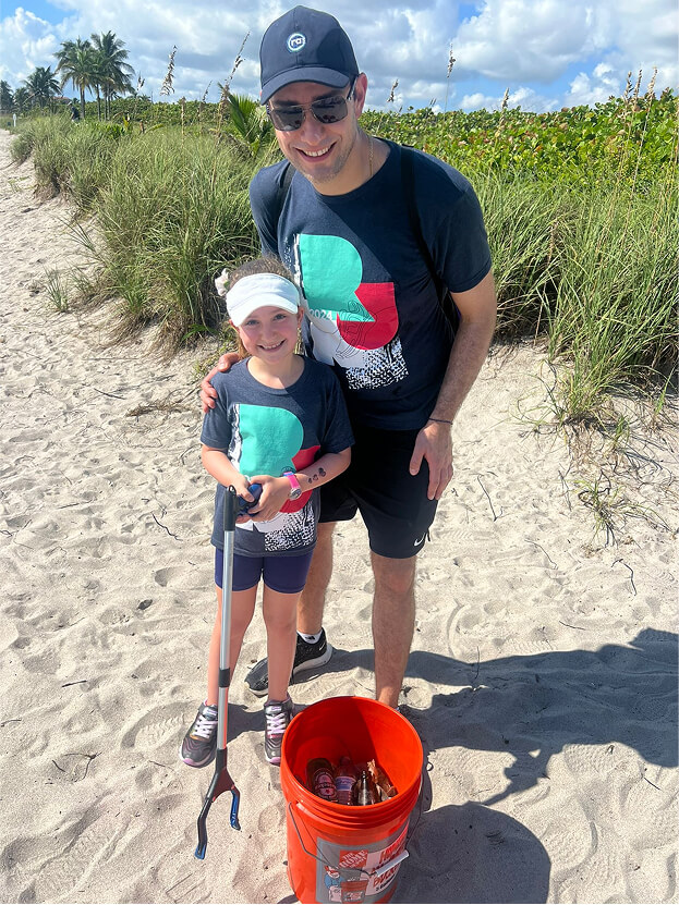 RAB2B parent and daughter cleaning the beach
